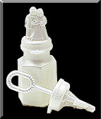 Bride and Groom top pearlized wedding bubbles with wand in cap.